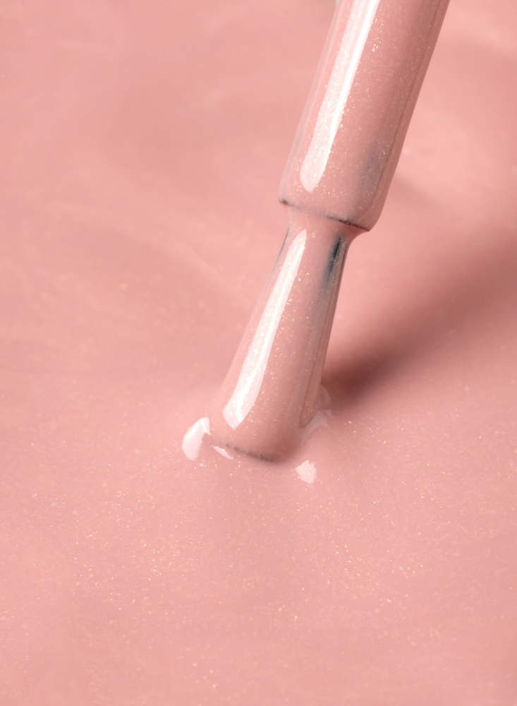 Soft pink nail polish detail for nail salon services
